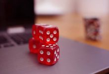three red dice on the table