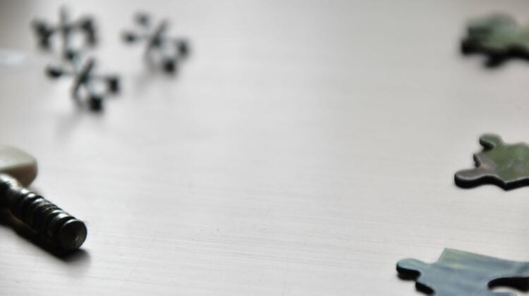 a close up of a piece of puzzle on a table